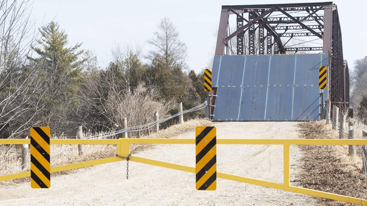 Residents decry installation of large steel barricades on Peel Street bridge