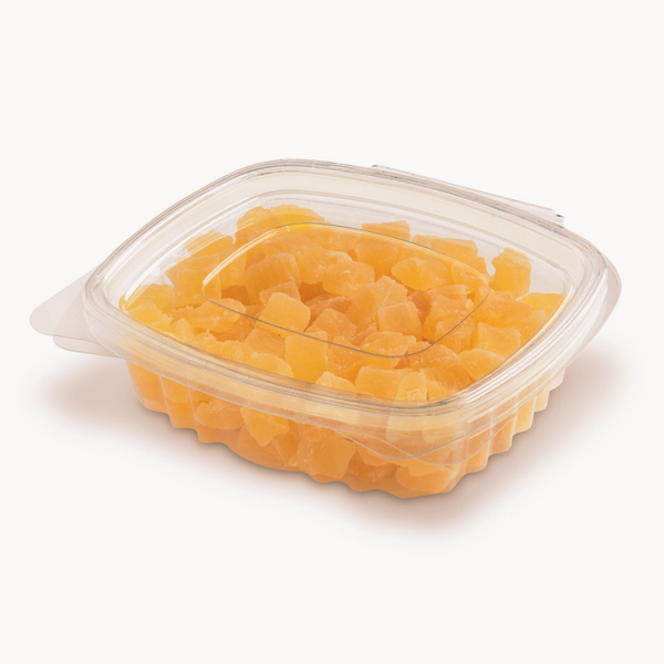 Contenitore trasparente richiudibile con pezzi di frutta giallo-arancione, coperchio sagomato e linguette laterali, su sfondo bianco.
