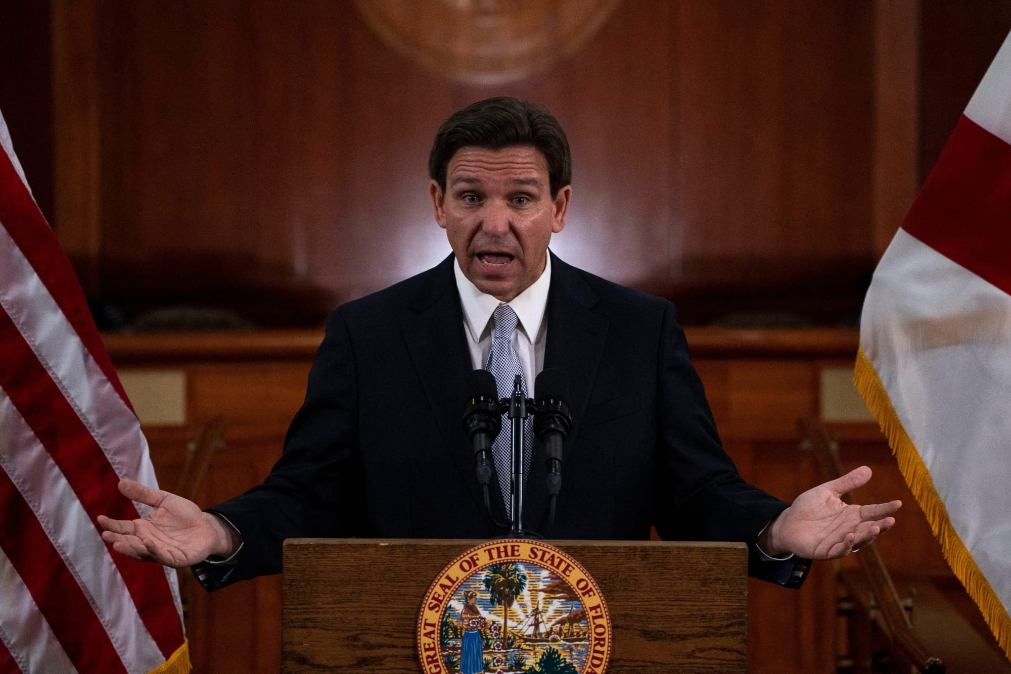 Florida Gov. Ron DeSantis speaking at a podium