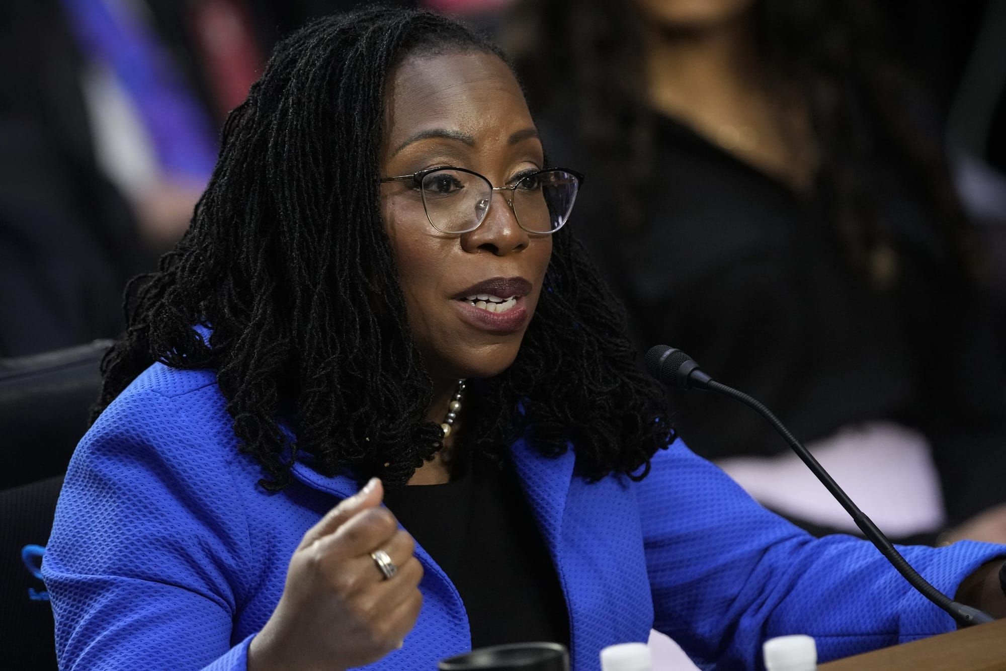 ketanji brown jackson wears a blue suit jacket as she speaks during the Supreme Court confirmation hearing