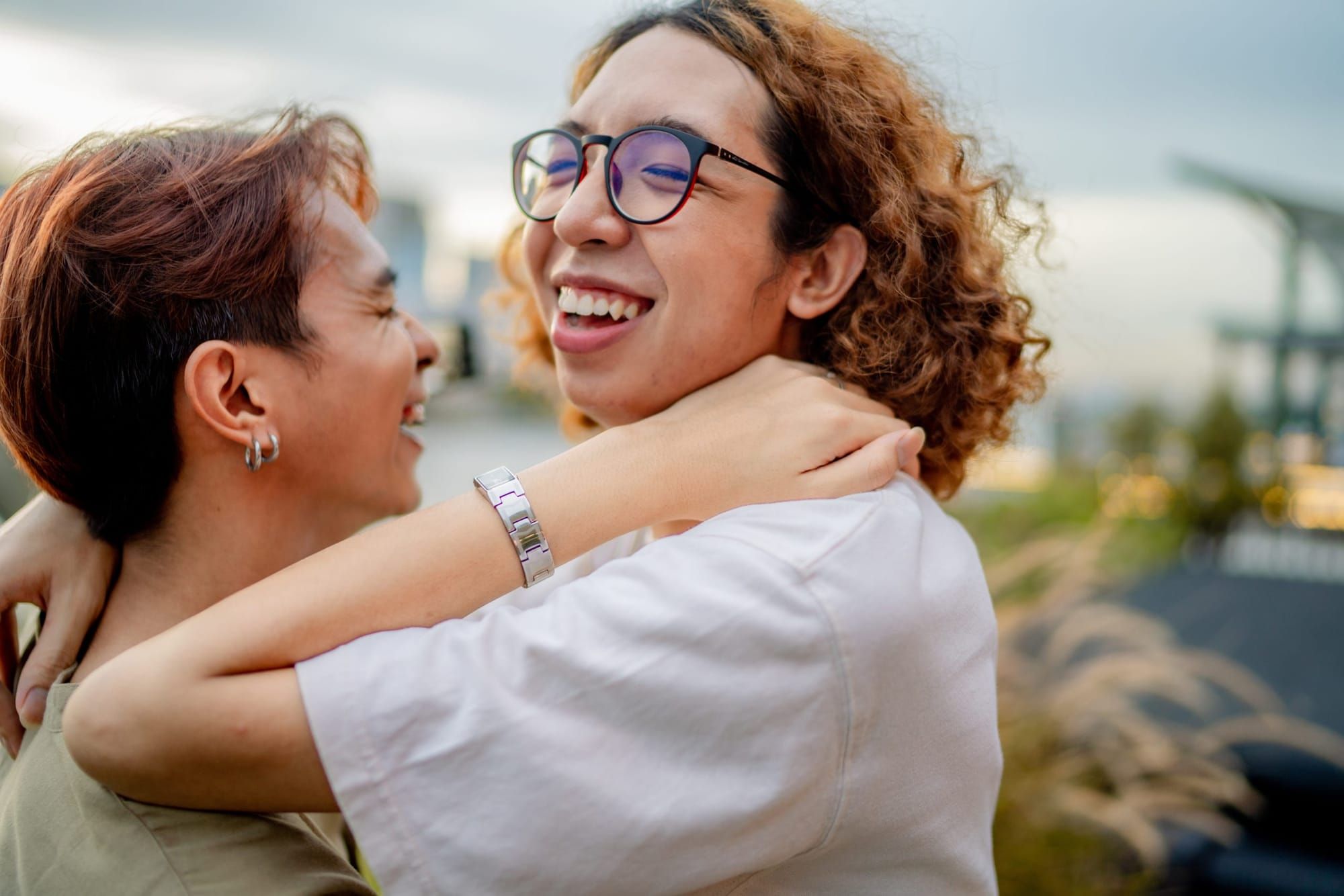 two young people embrace