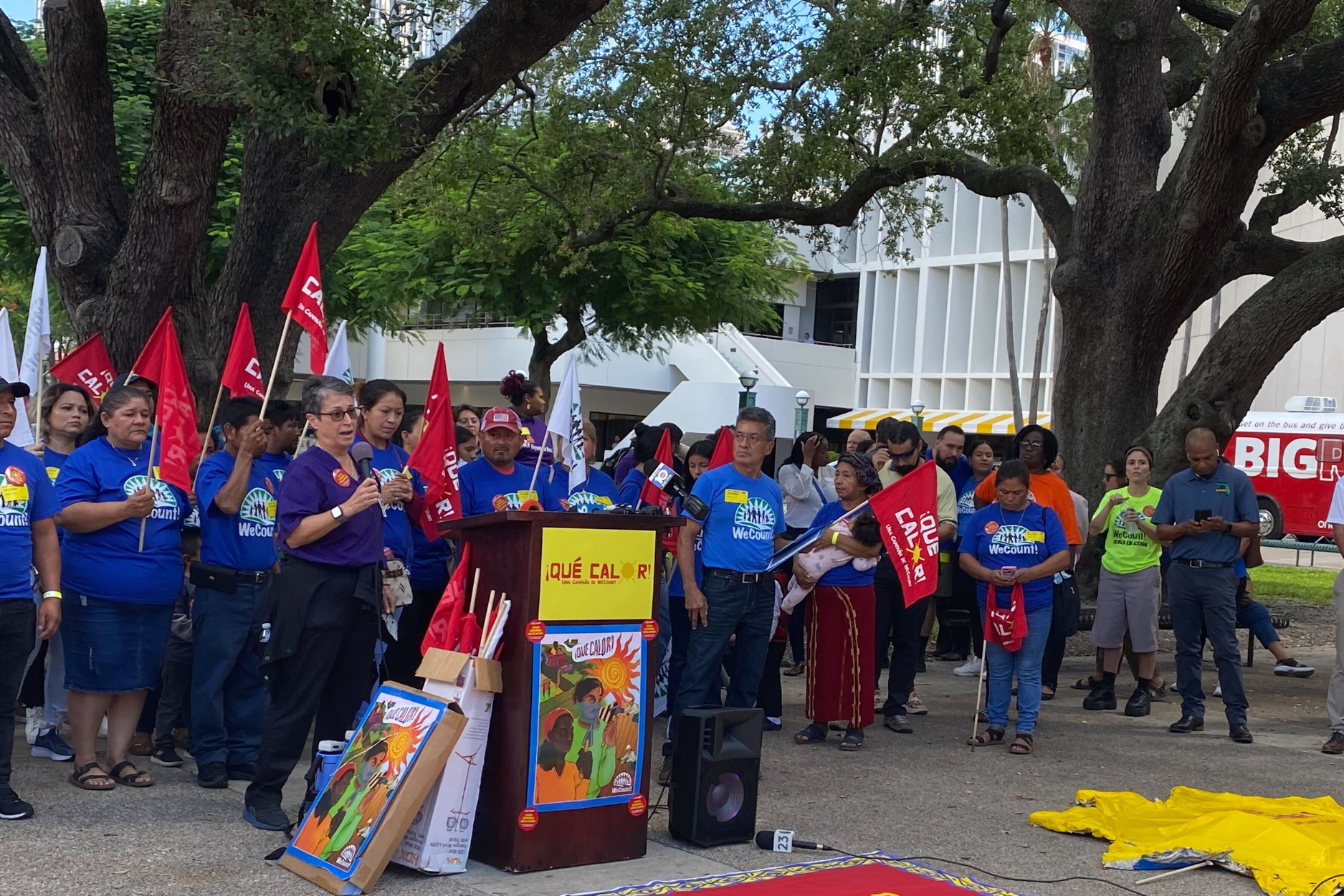 color photograph of an outdoor protest in support of farmworkers' labor rights. people of varying ages and racial backgrounds