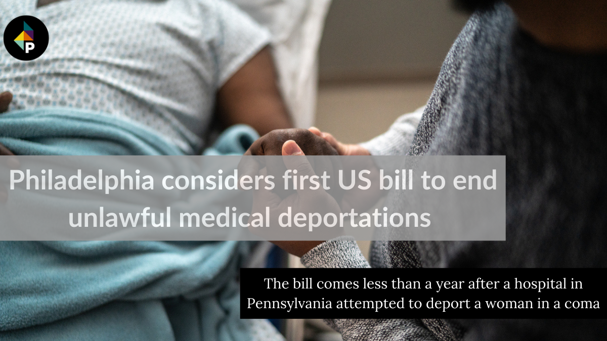 color photograph of a Black person lying in a hospital bed with the face out of frame. another Black person holds their hand