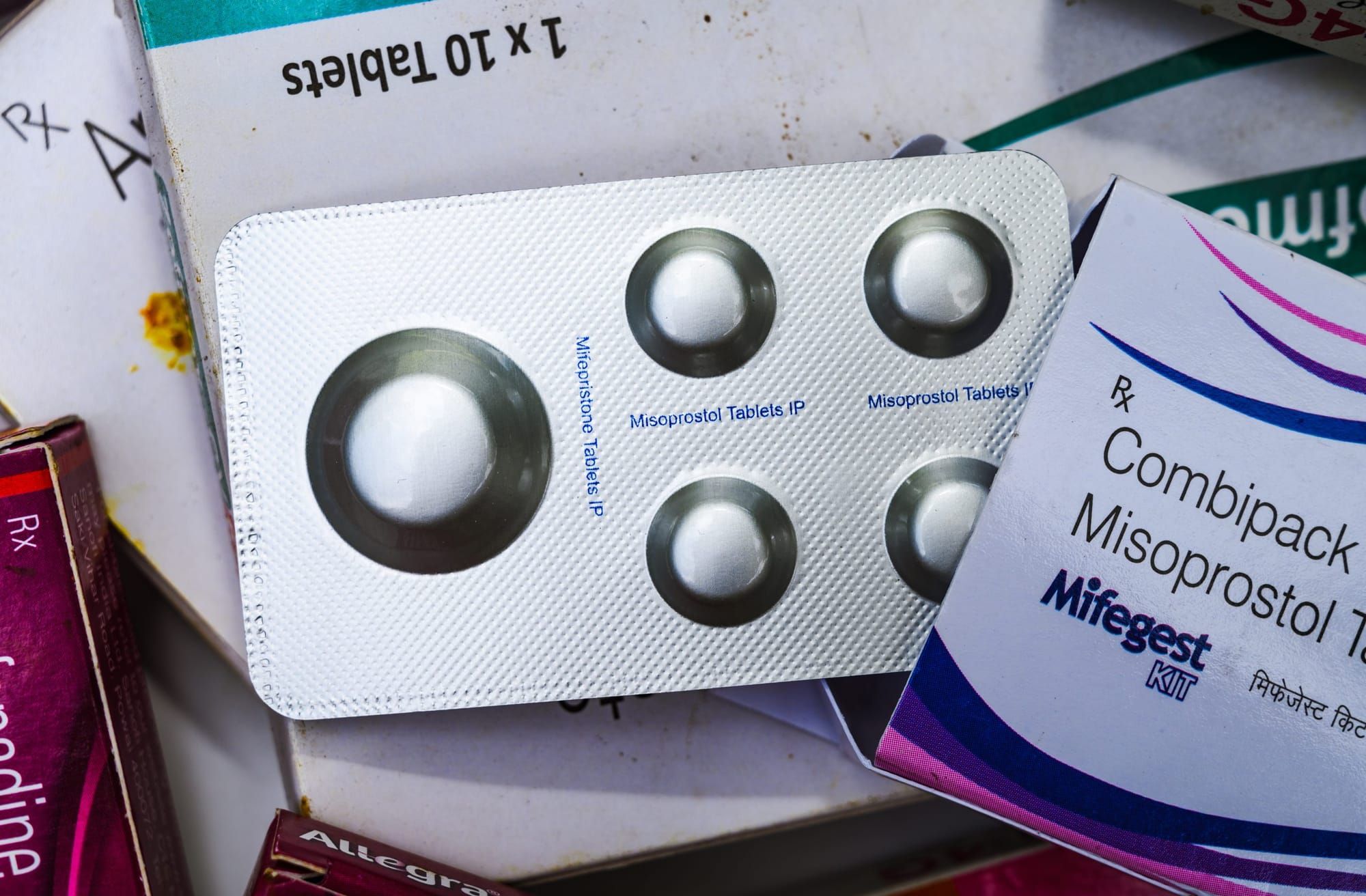 color photograph, top-down close-up of a package of misoprostol and mifepristone pills