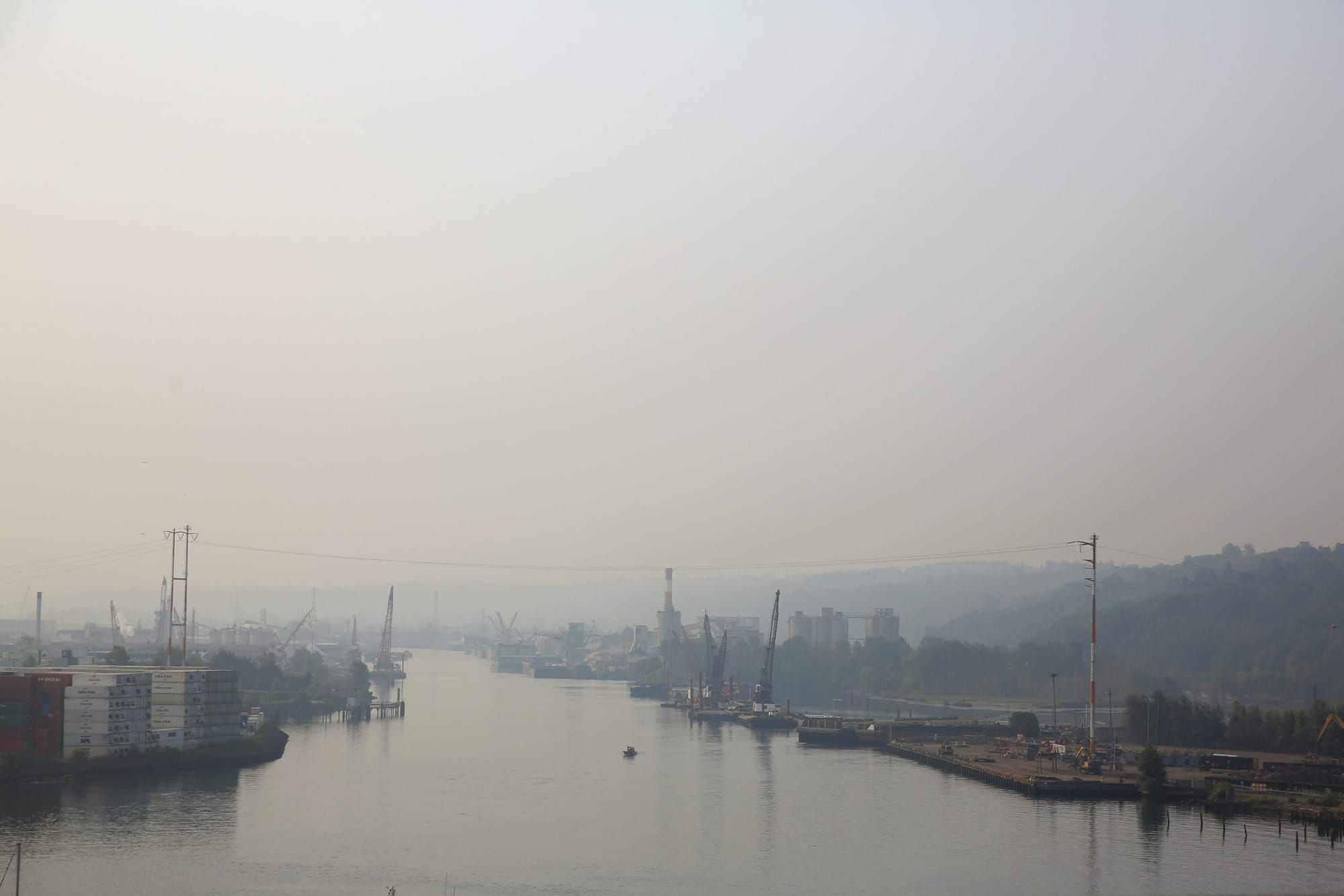 color landscape photograph of thick hazy hanging over the Duwamish River