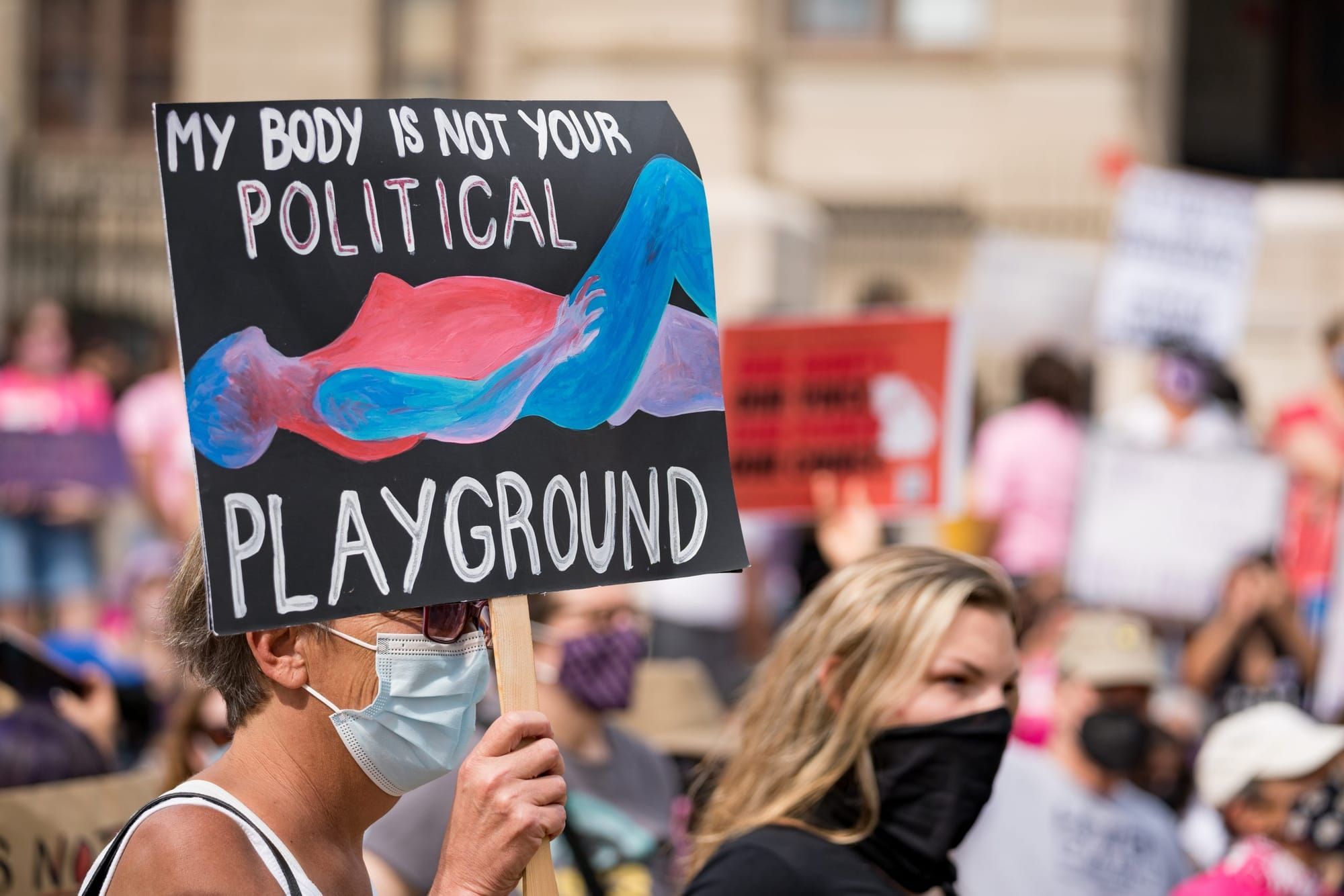 color photograph of an outdoor protest in support of women's rights