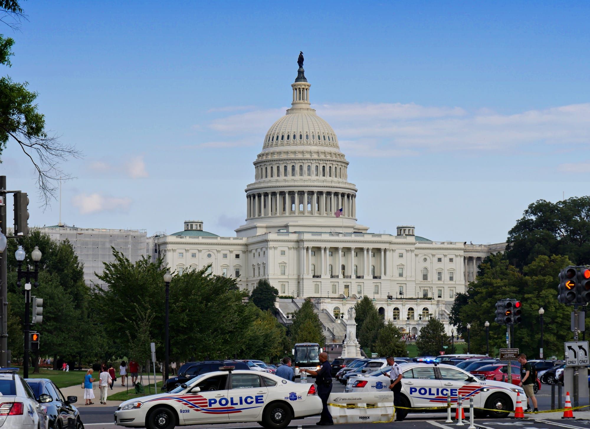 Police cars and officers line the street in Washington, D.C., on Pennsylvania Avenue.