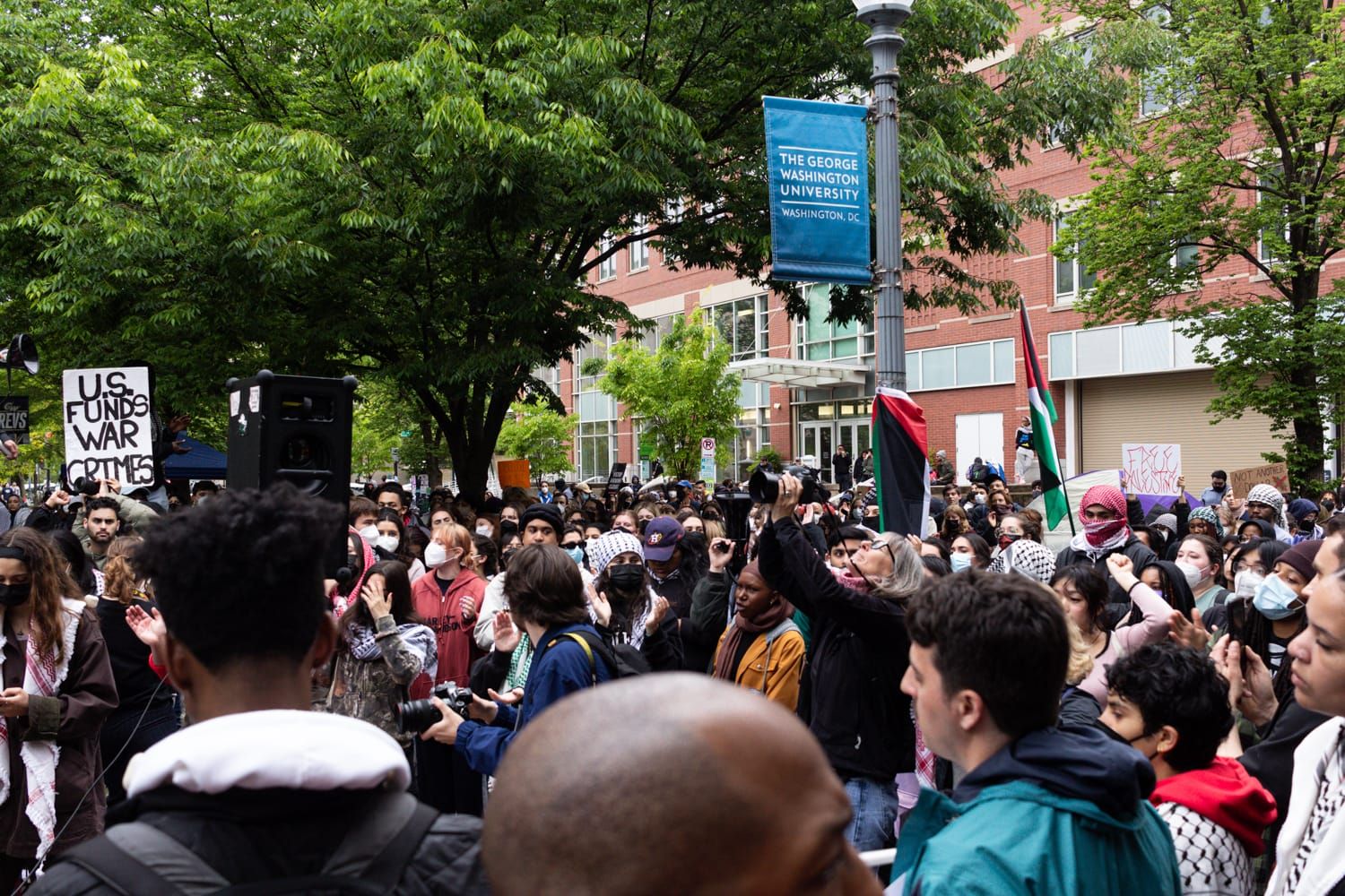 students gather outside during campus protest for Palestine