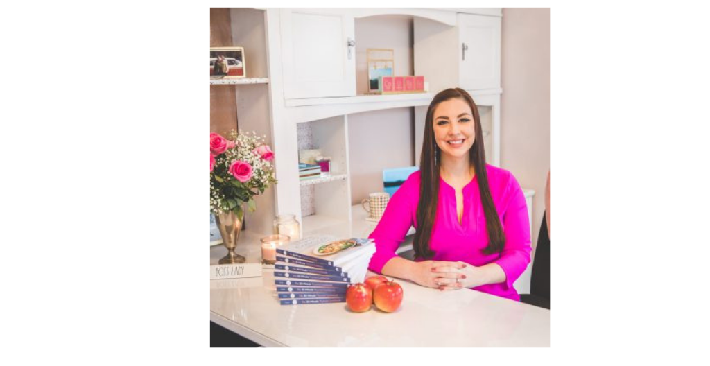 image-of-emily-kyle-sitting-with-her-recipe-book