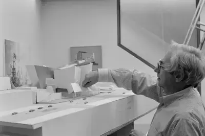 Photo of Frank Gehry constructing the architectural model for Walt Disney Concert Hall