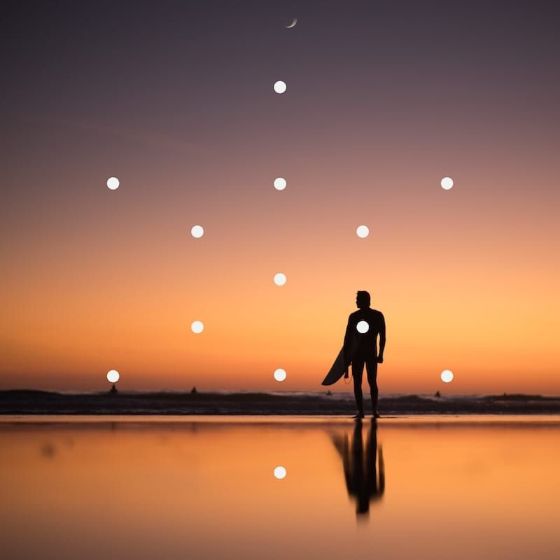 A surfer at sunset