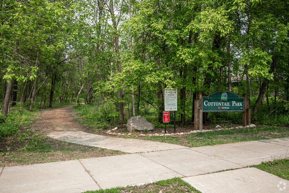 May be an image of grass, tree and text