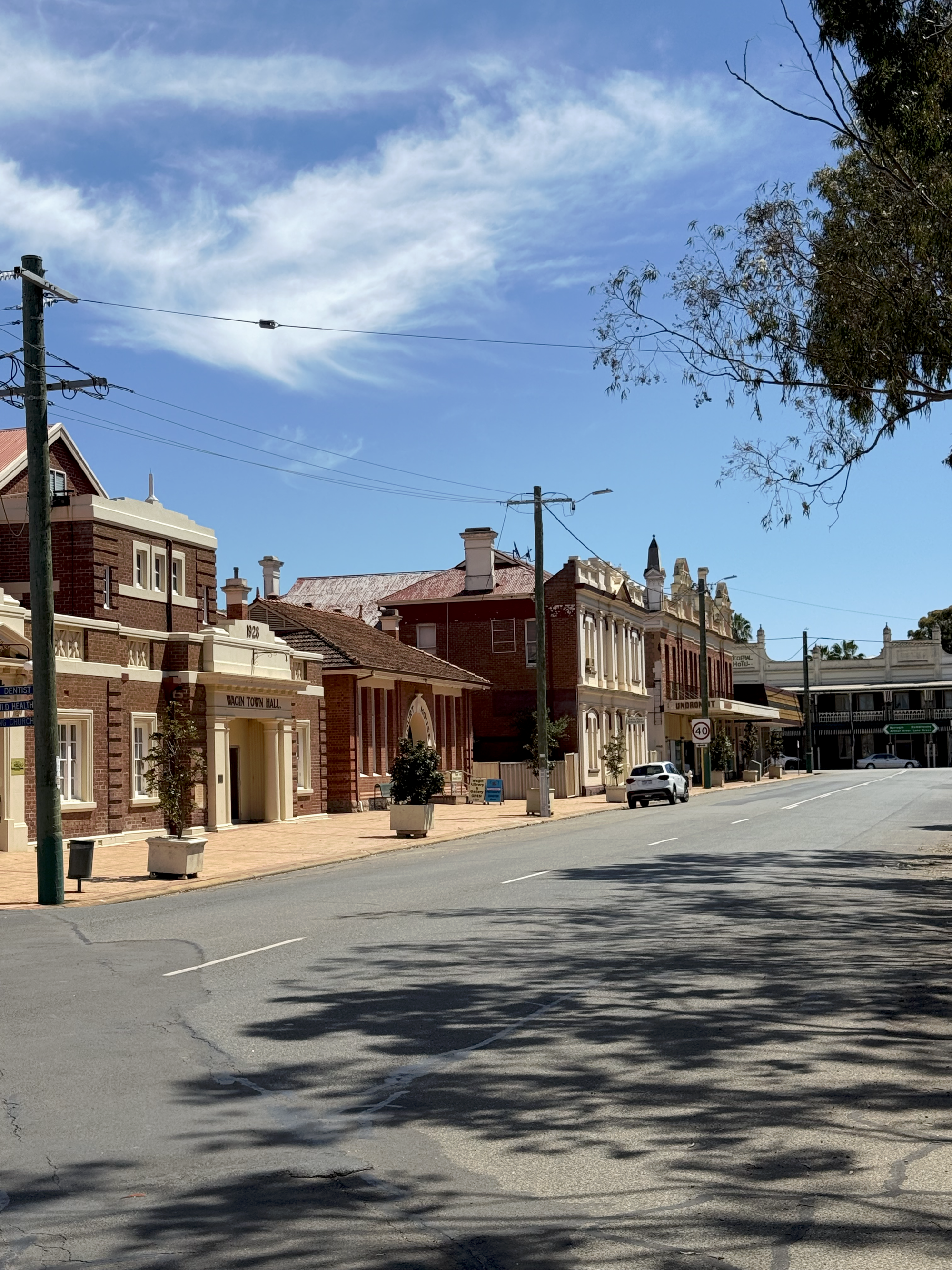 Wagin main street, with the red brick town hall and heritage shopfronts.