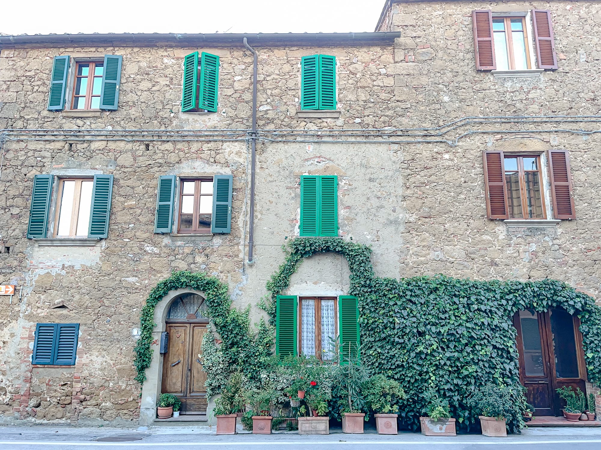 Ivy-covered buildings in Castelmuzio, Italy