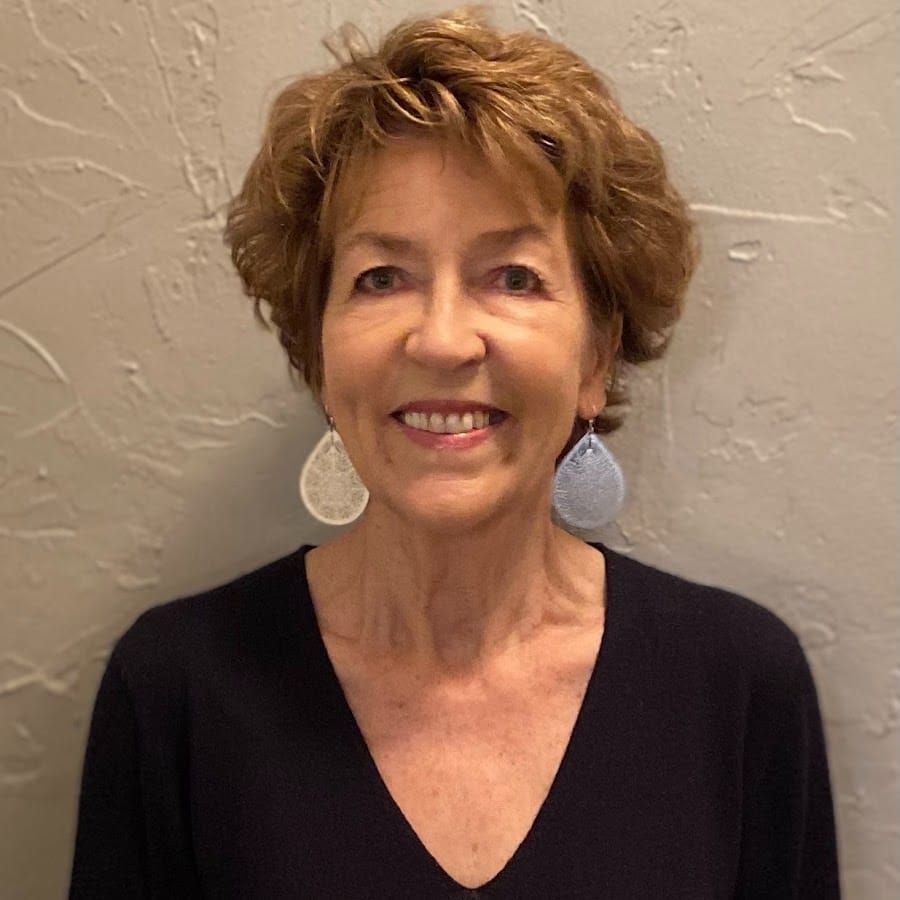 Portrait of Isla Reddin, a warm and confident teen parenting coach, smiling naturally. 