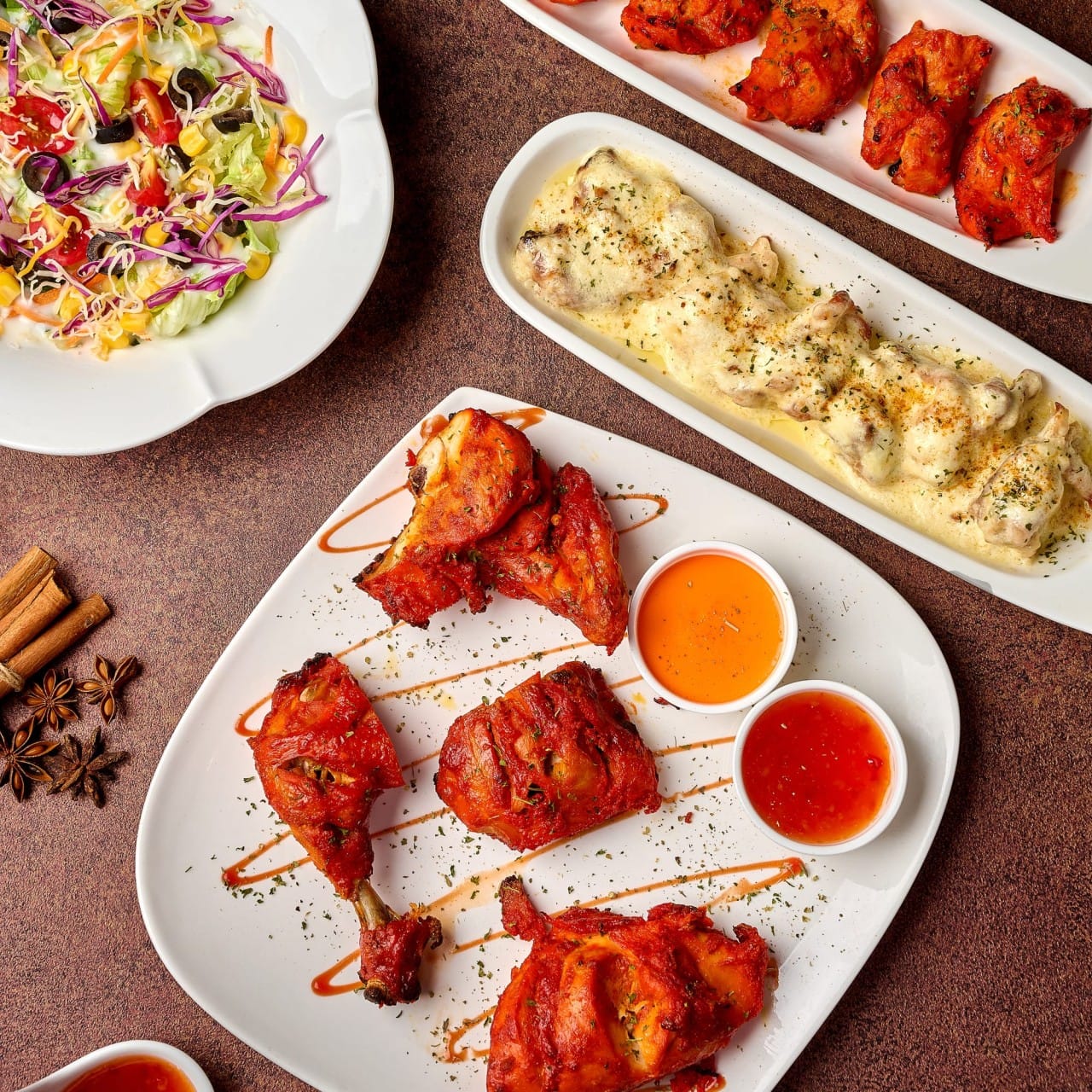 Grilled tandoori chicken platter with dipping sauces, creamy baked curry, and fresh salad at Curry Kingdom Technopolis in Daegu
