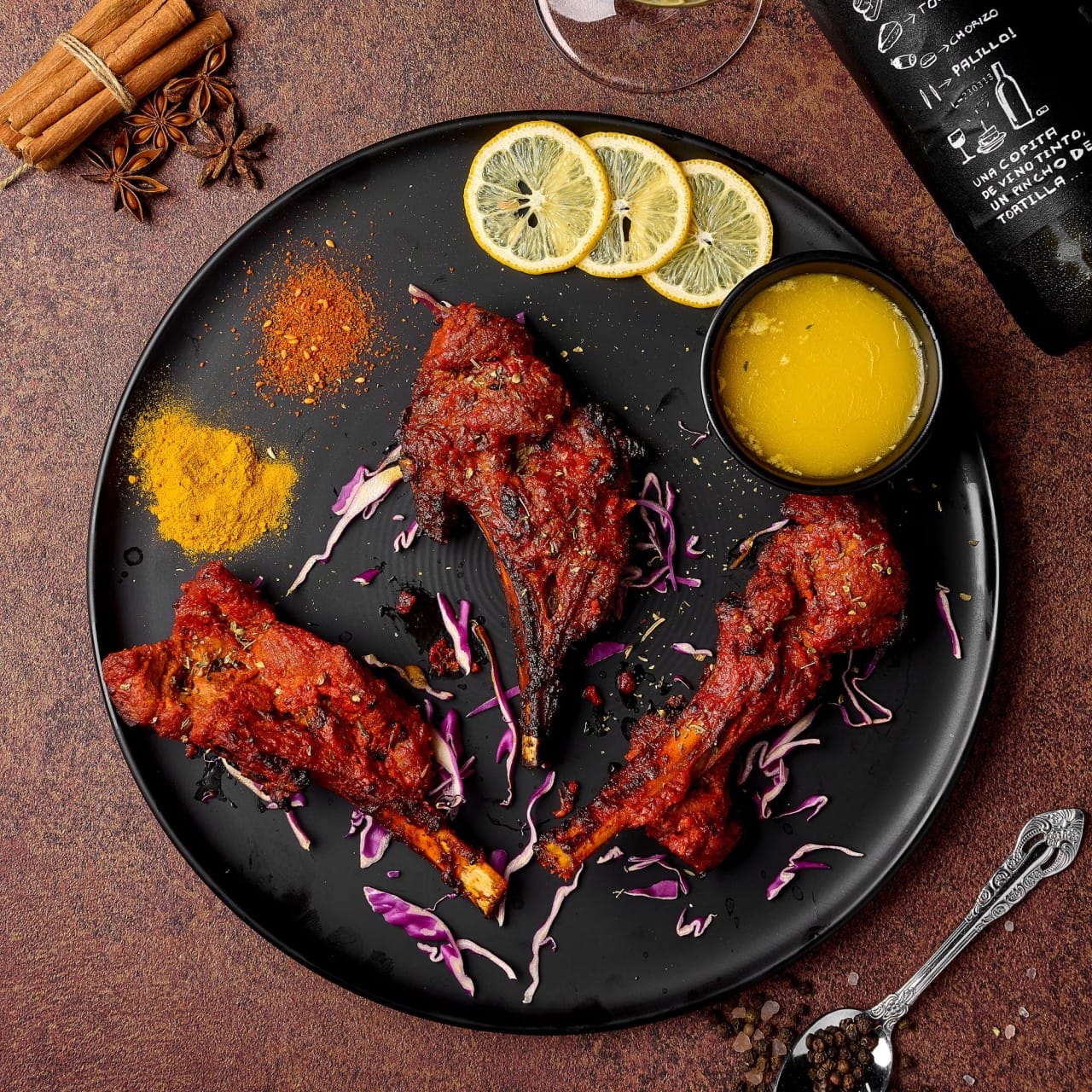 Juicy grilled tandoori lamb chops served with lemon slices and dipping sauce at Curry Kingdom West Daegu