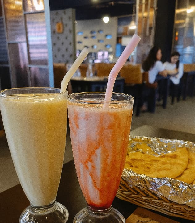 Vanilla and strawberry lassi drinks with naan bread at Machan Indian restaurant in Korea