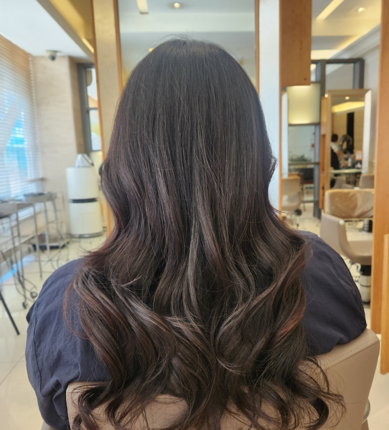 A woman after receiving hair styling at Juno Hair salon in Bundang