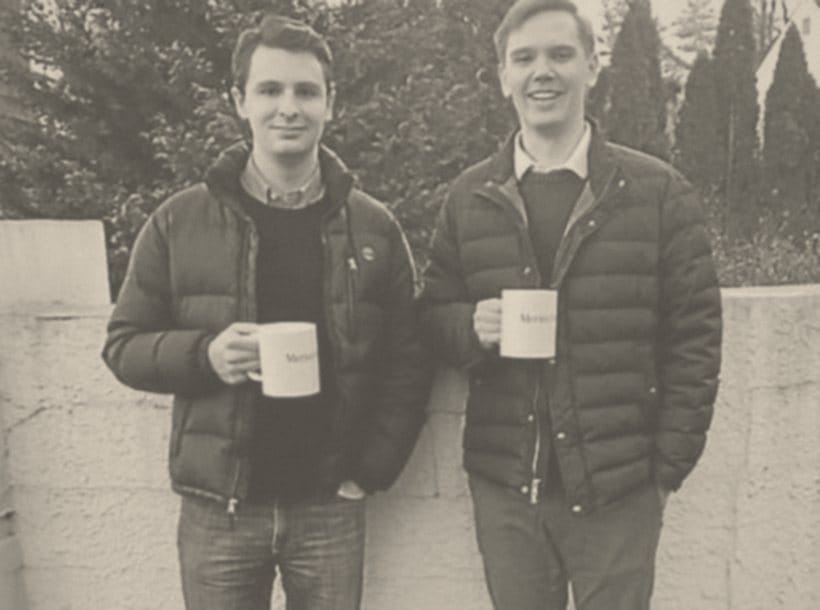 Erich J. Prince and Henri Mattila holding Merion West mugs, 2018