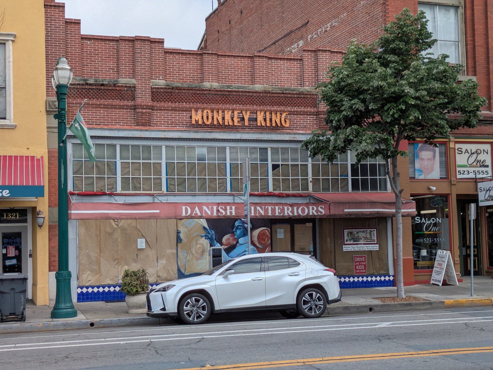 Monkey King's new storefront on Park Street with construction paper in the windows