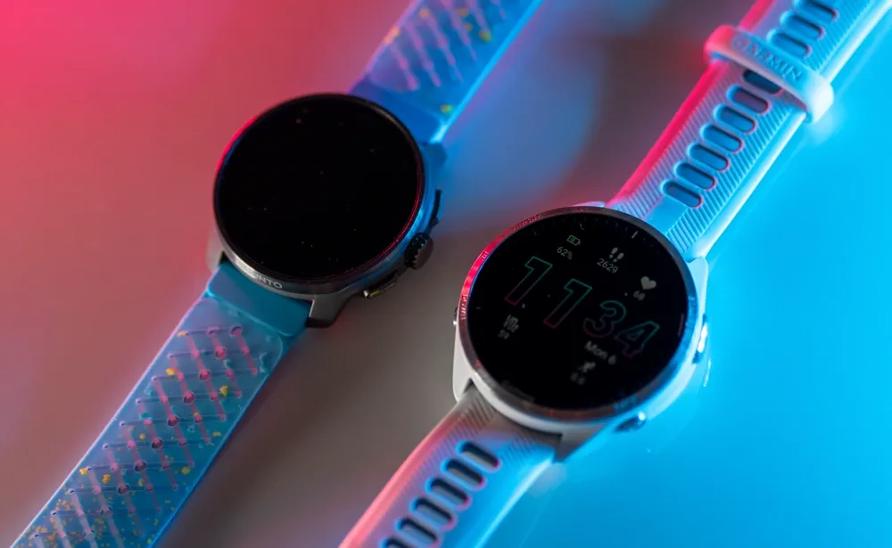 The Suunto Race S next to the Garmin Forerunner 965