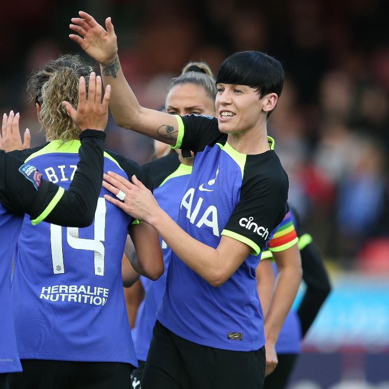 Ashleigh Neville high-fives a teammate out of frame