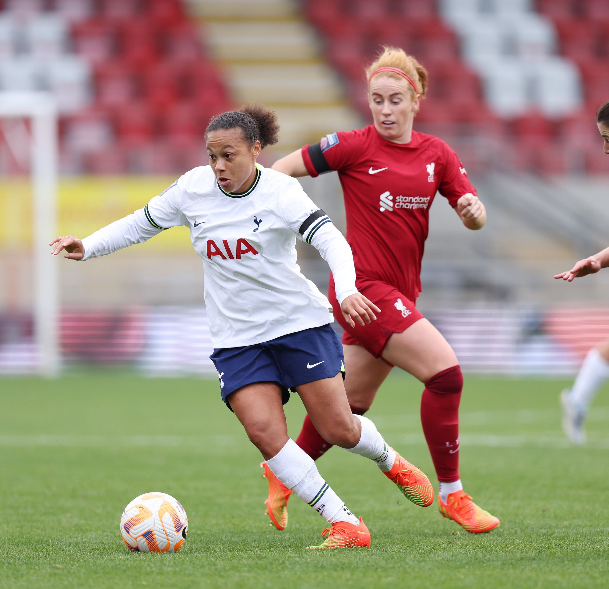 Drew Spence dribbles past Liverpool's Rachel Furness