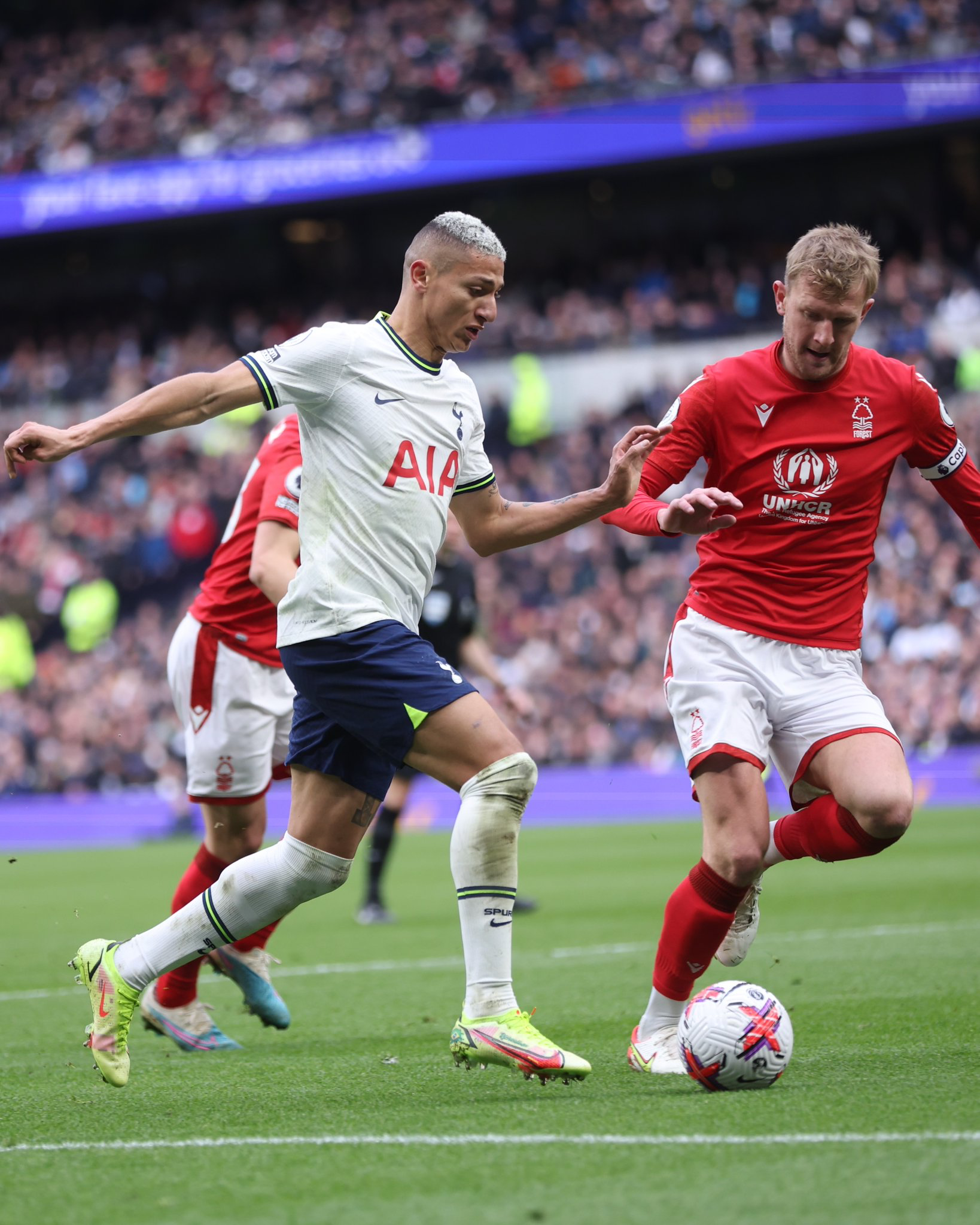 Richarlison dribbles past a Nottingham Forest player.