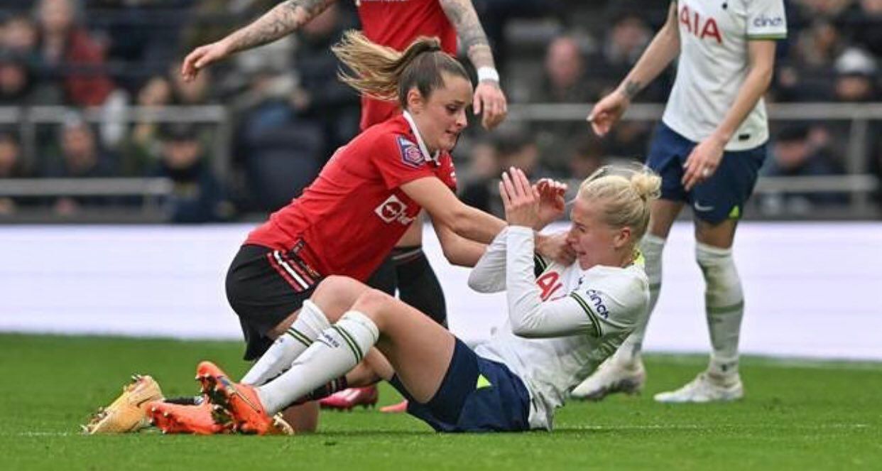 Ella Toone shoves Eveliina Summanen to the ground.