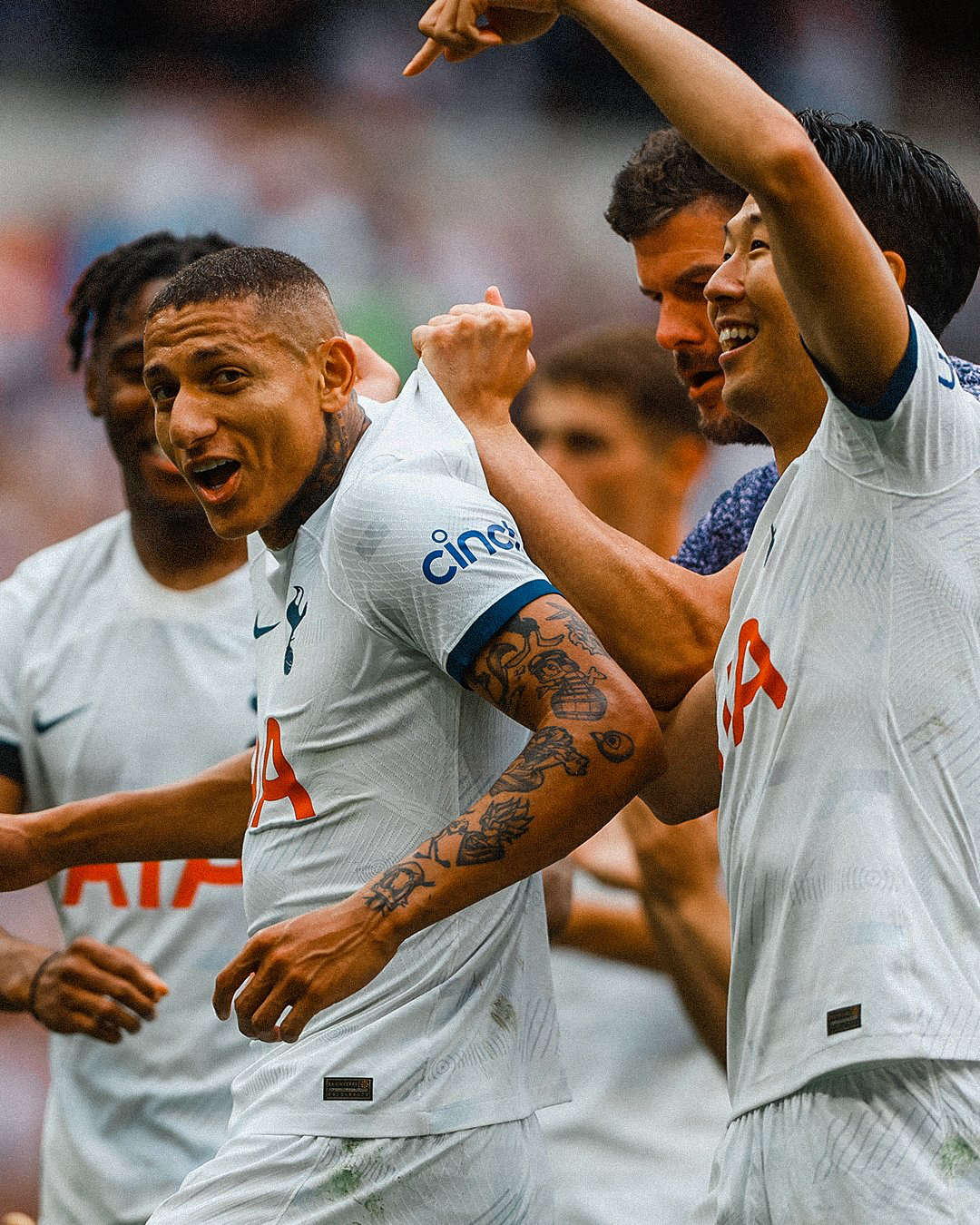 Son Heung-min points to Richarlison's name on his kit to celebrate the latter's game-winning assist..