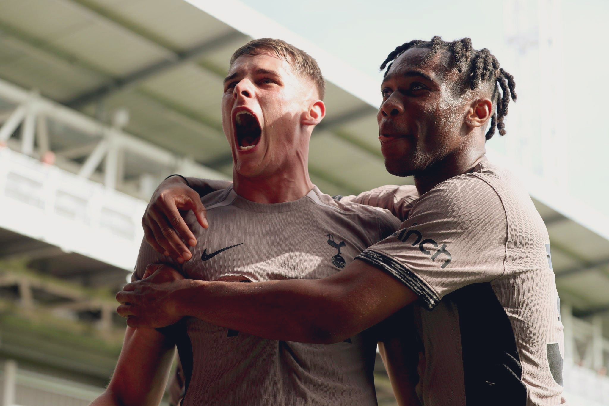 Destiny Udogie hugs a roaring Micky van de Ven.