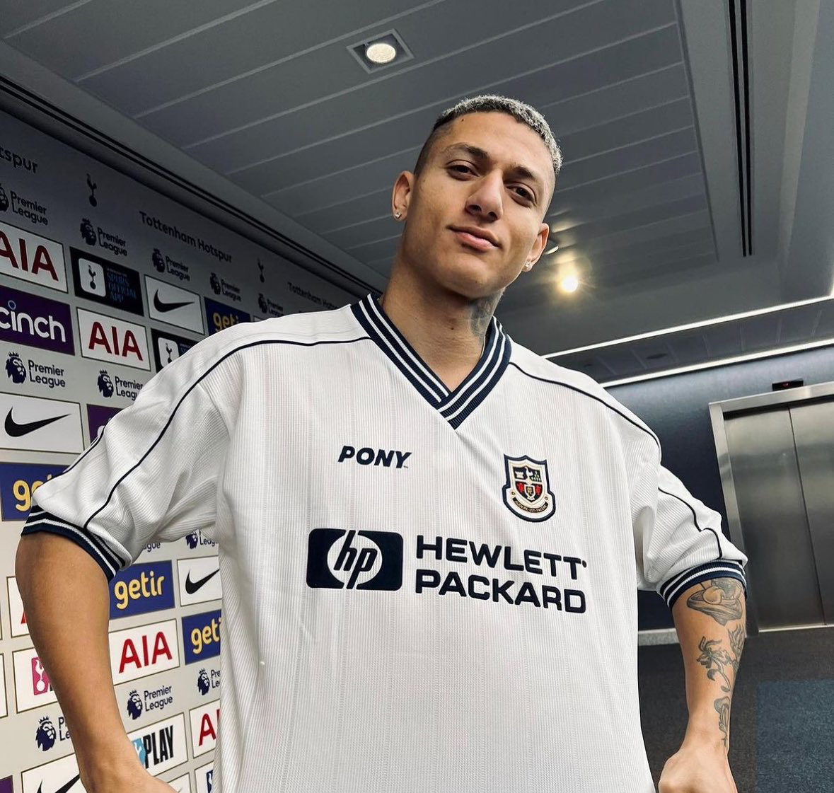 Richarlison sports a vintage Spurs kit by Pony.