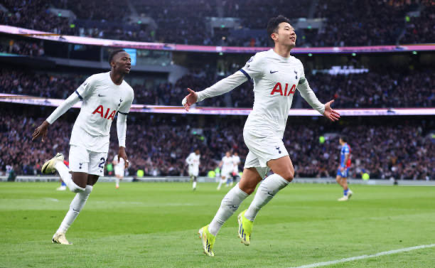 Son Heung-min celebrates his goal against Crystal Palace, with Pape Sarr behind him.