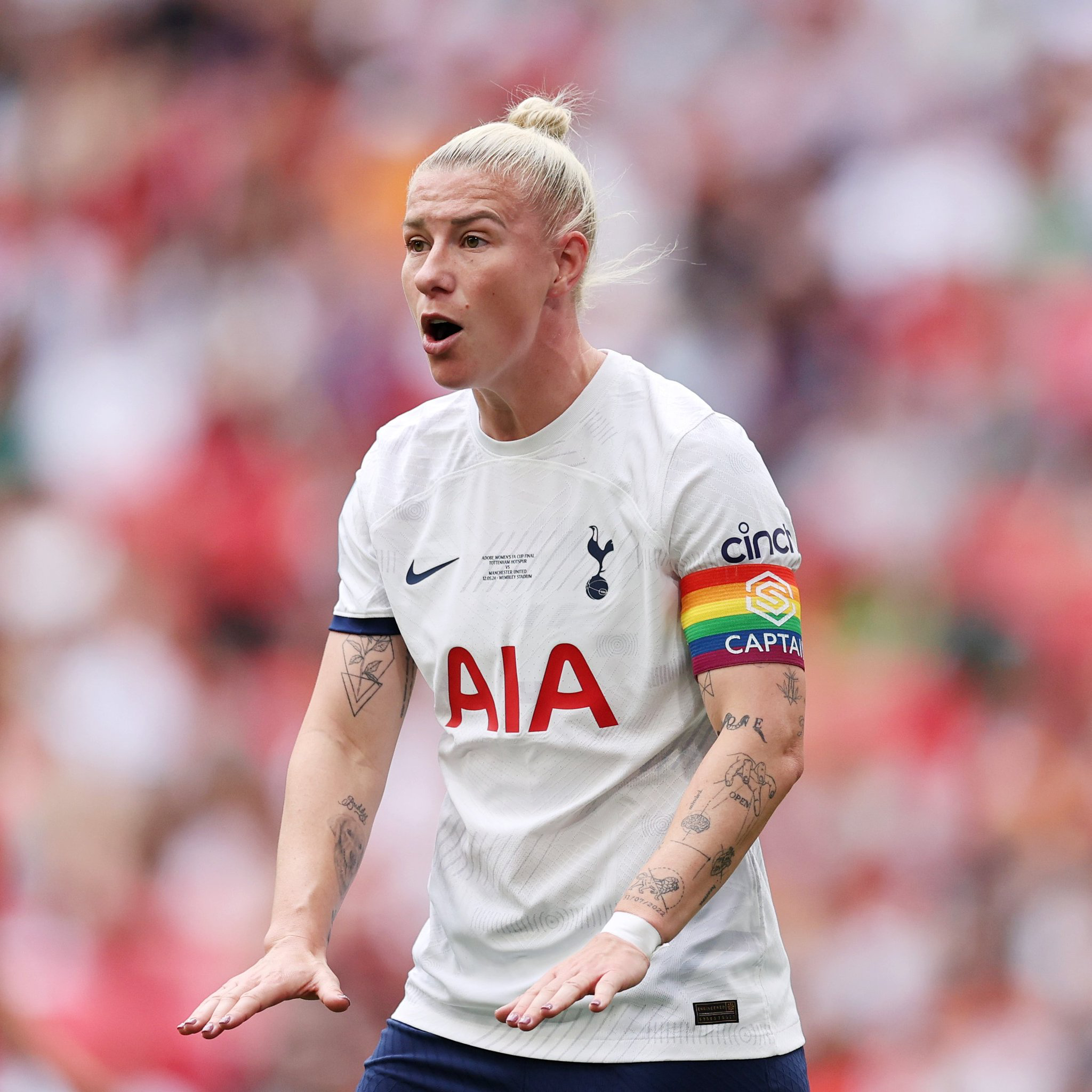 Beth England motions for calm. 