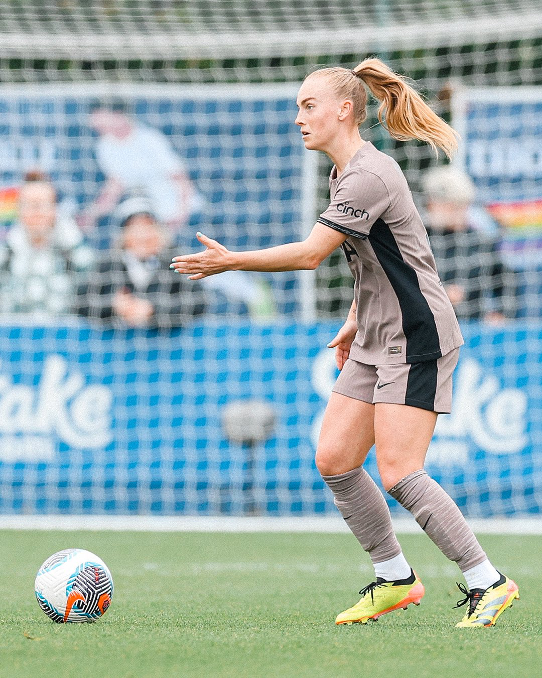 Molly Bartrip gestures with the ball at her feet.