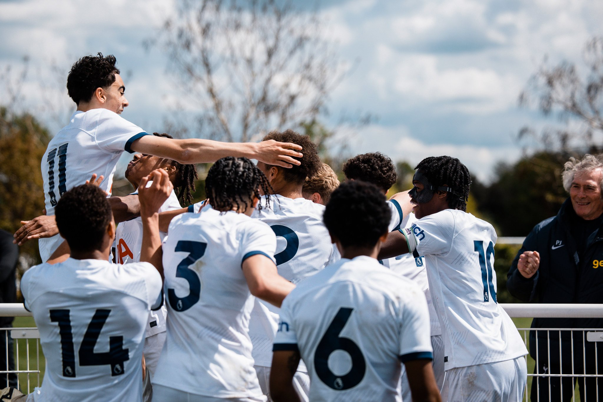 The Men's Academy U18s celebrate a win in the NLD as Pat Jennings looks on.