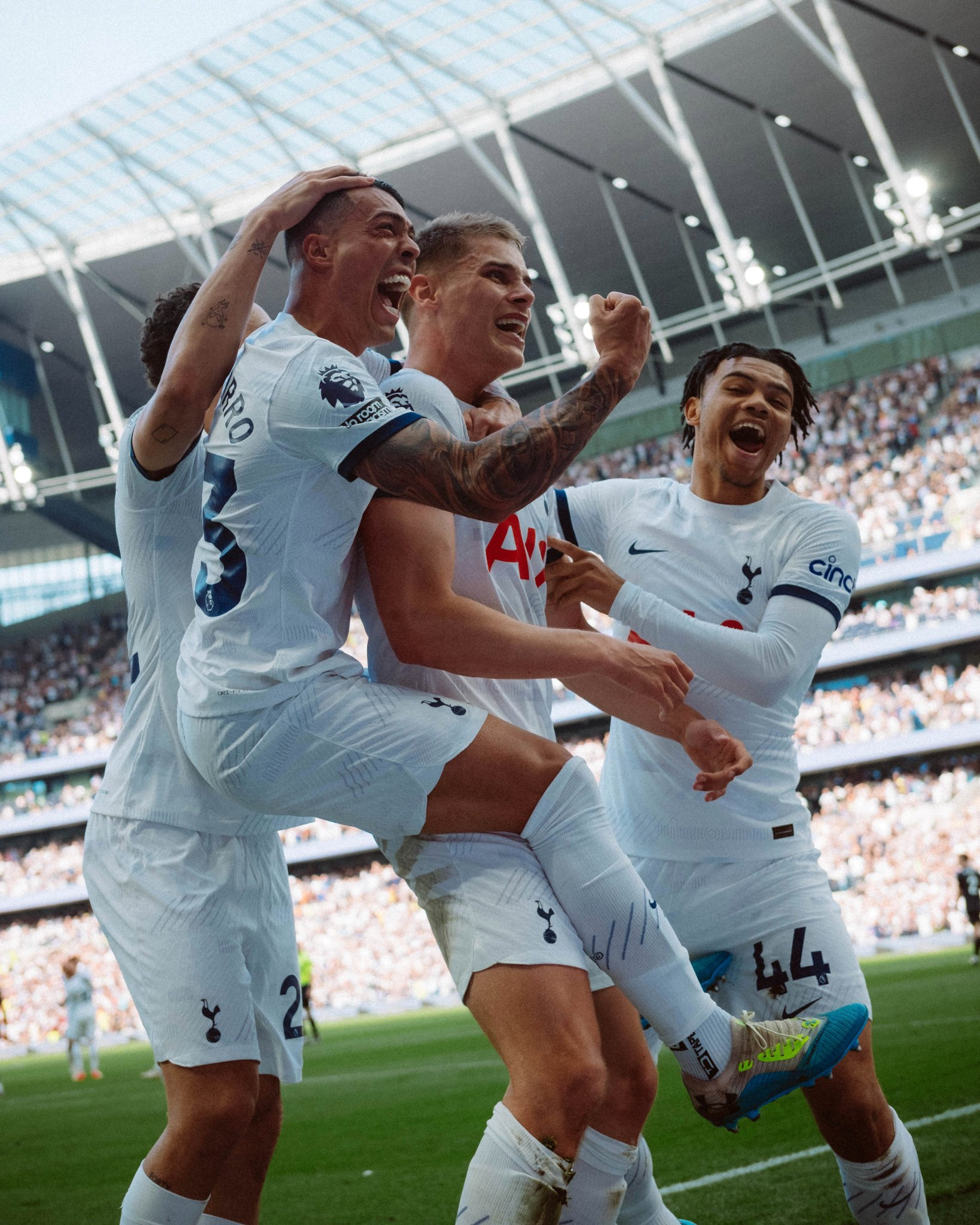 Micky van de Ven celebrates his game-winning goal with Pedro Porro and Dane Scarlett. 