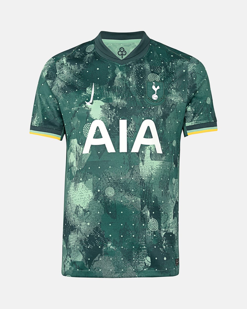 The Tottenham third kit for 2024/25, green with an abstract pattern, tri-tone sleeve trim, vertical Nike swoosh, and retro monochrome badge.