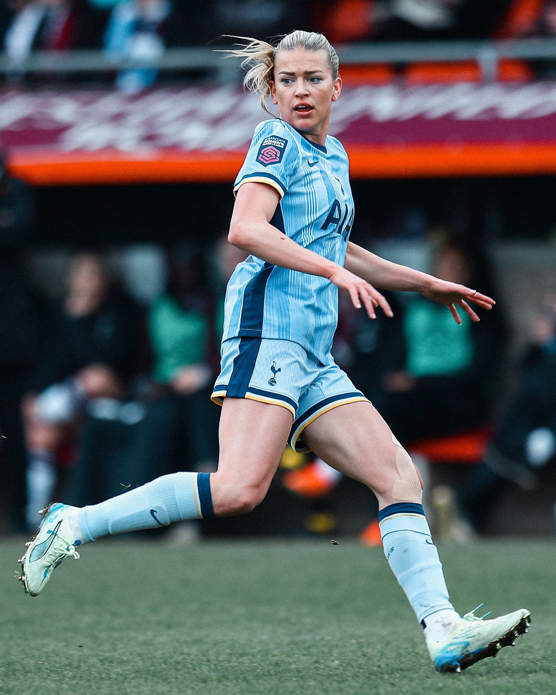 Charli Grant scans the pitch as she runs.