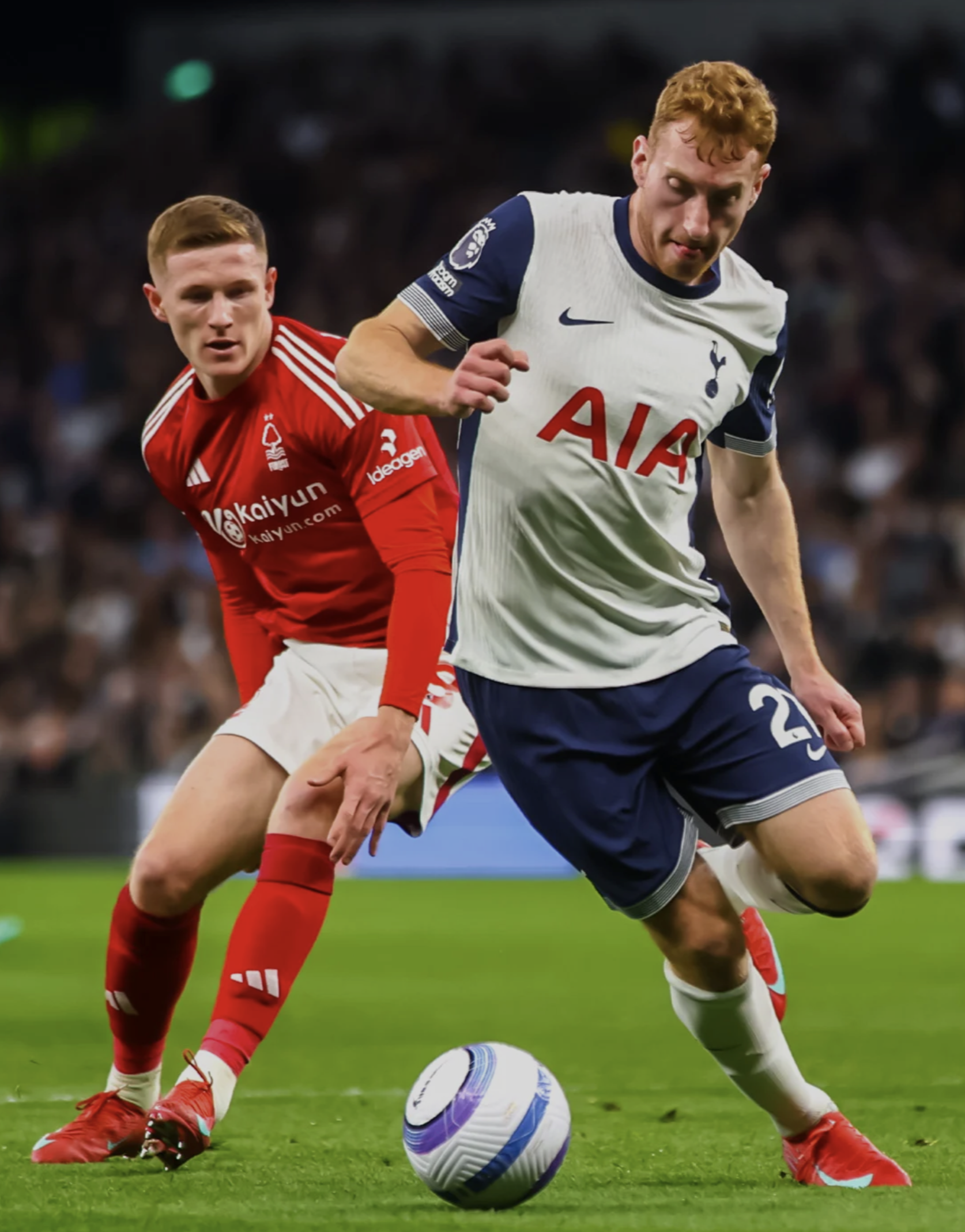 Dejan Kulusevski challenges Elliot Anderson for the ball.