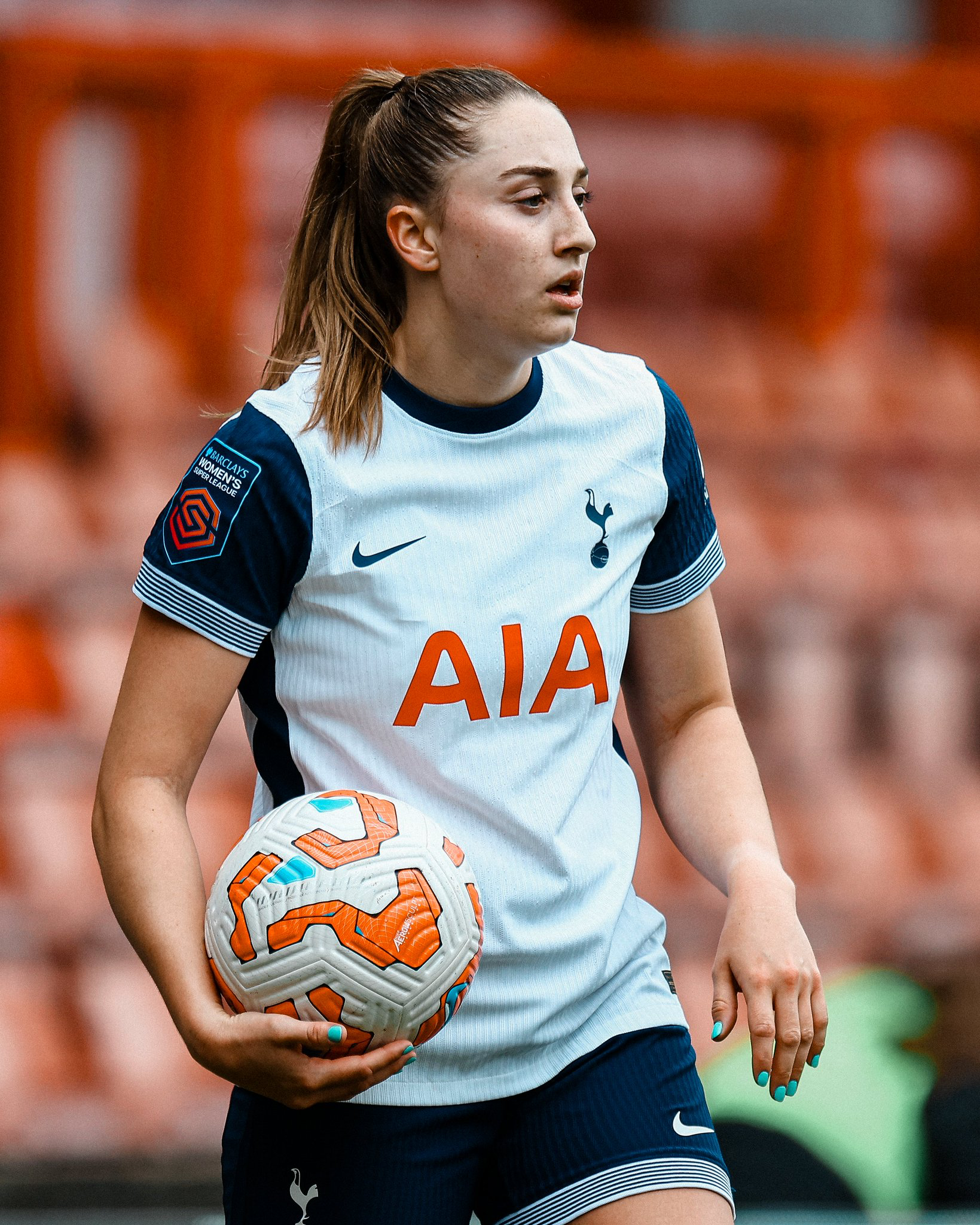 Ella Morris holds the ball, preparing to take a throw-in.