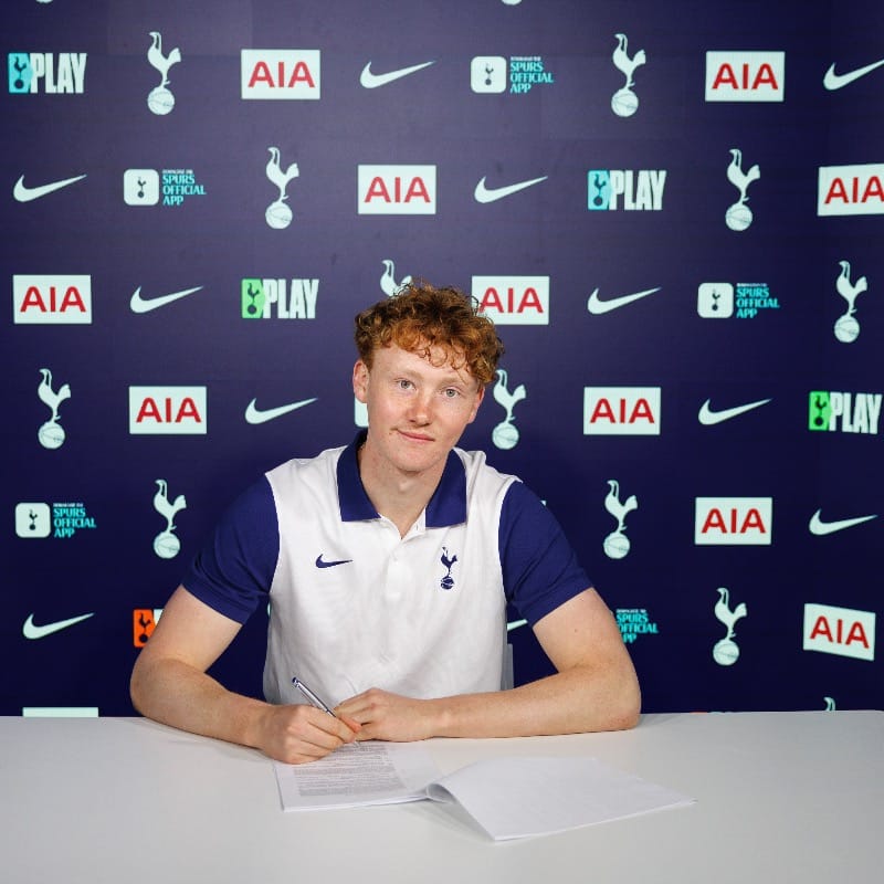 Aaron Maguire signs his new contract.