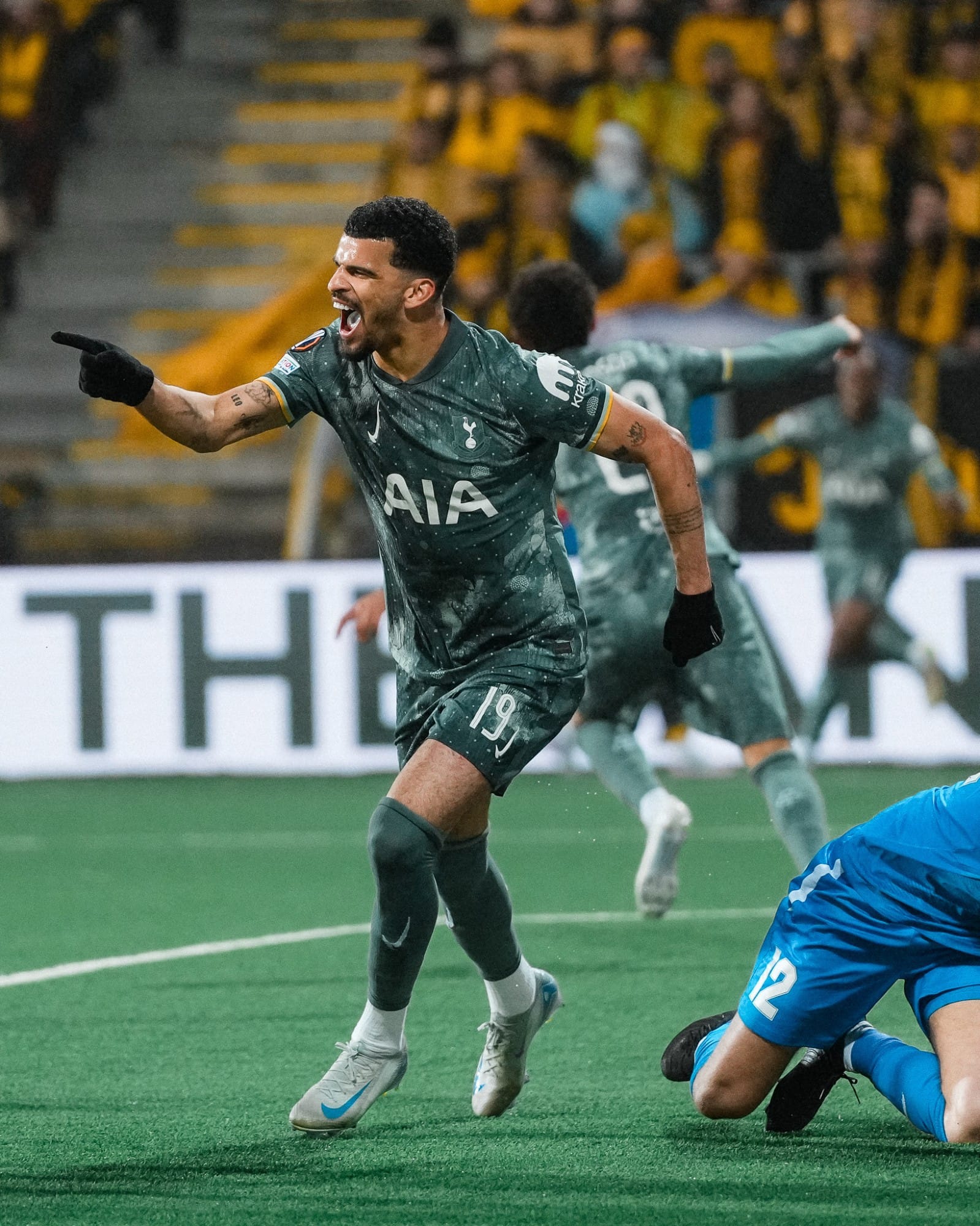 Dominic Solanke points as he runs off to celebrate his goal. 