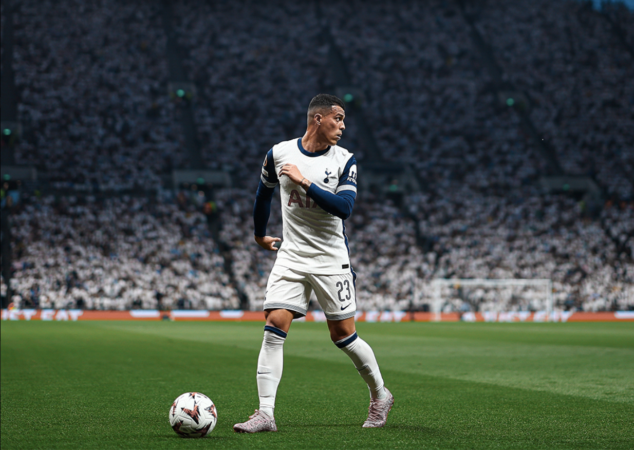 Pedro Porro scans the pitch with the ball at his feet.