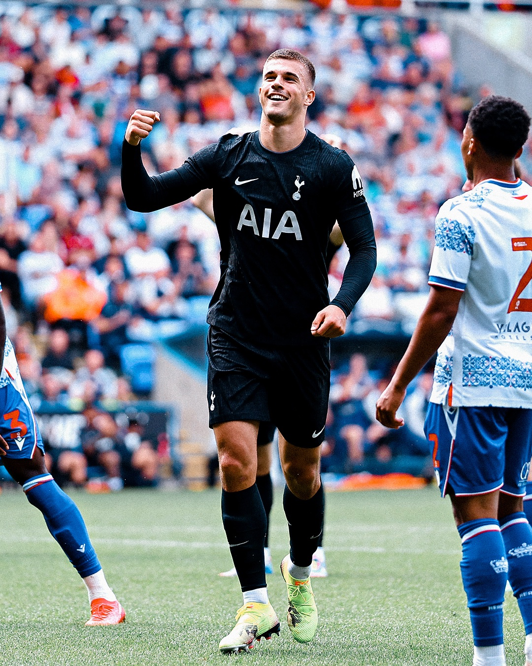 Luka Vušković holds up a fist to celebrate his goal.