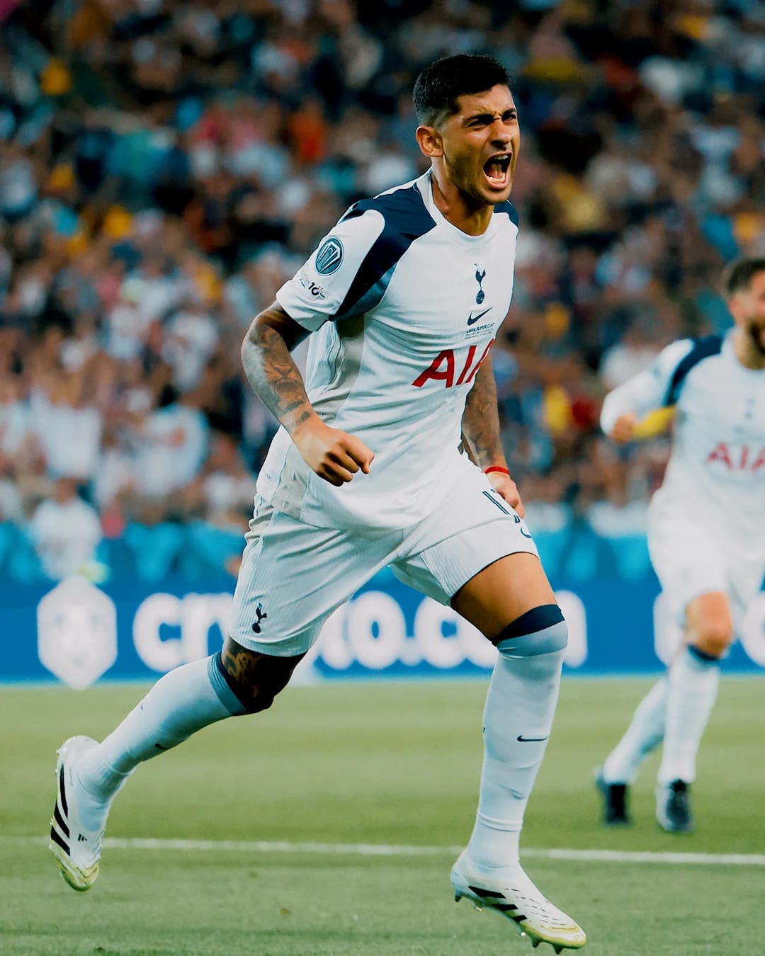 Cristian Romero roars after scoring a goal in the Super Cup.
