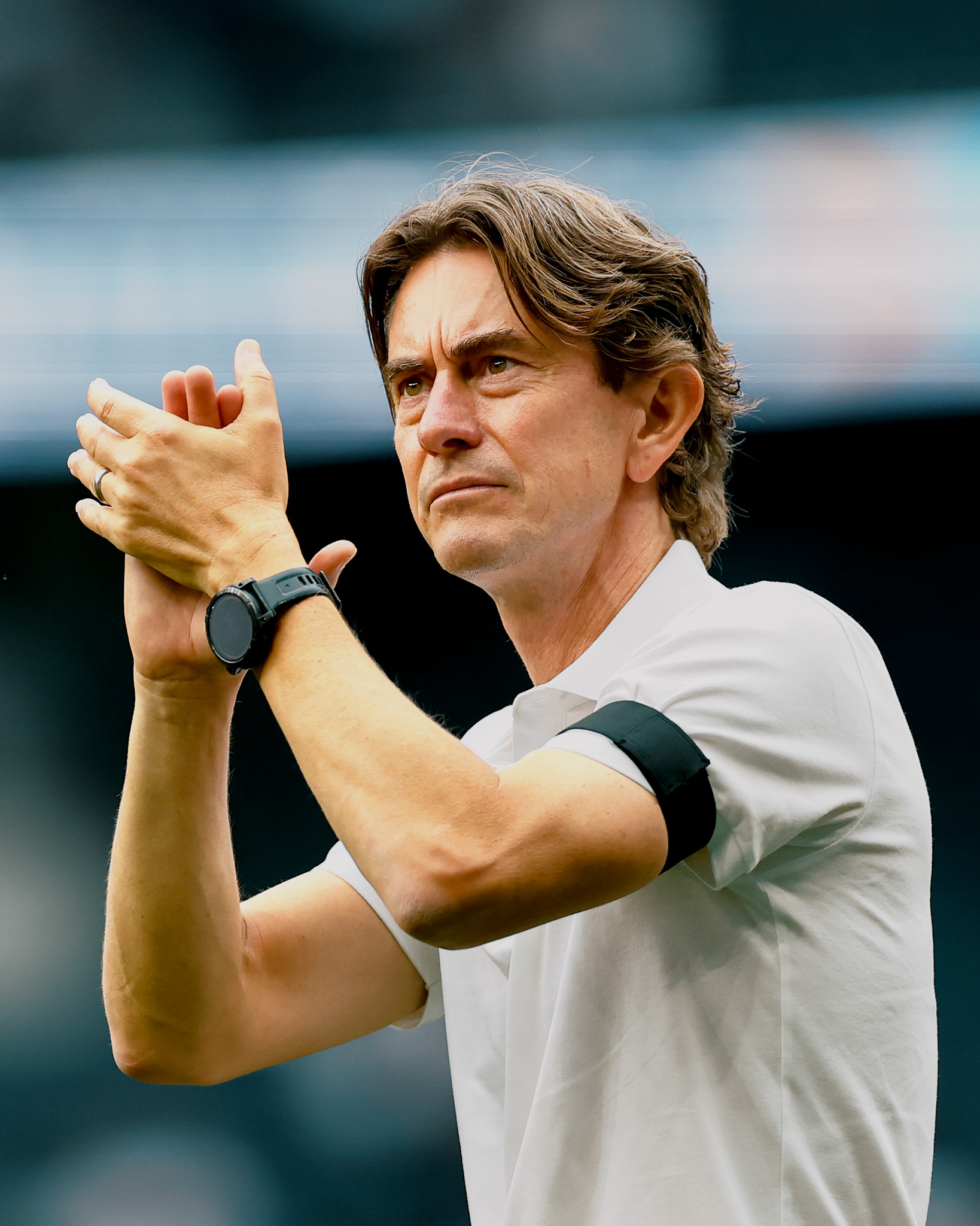 Thomas Frank applauds the fans.