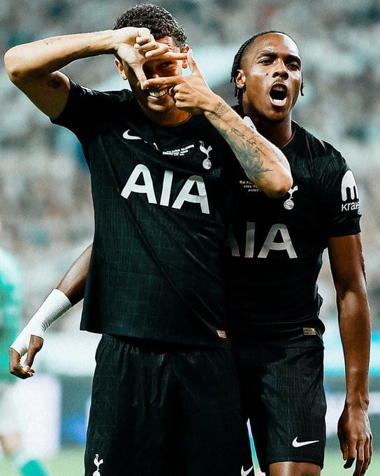 Brennan Johnson does Son Heung-min's signature camera goal celebration as Mathys Tel roars behind him.