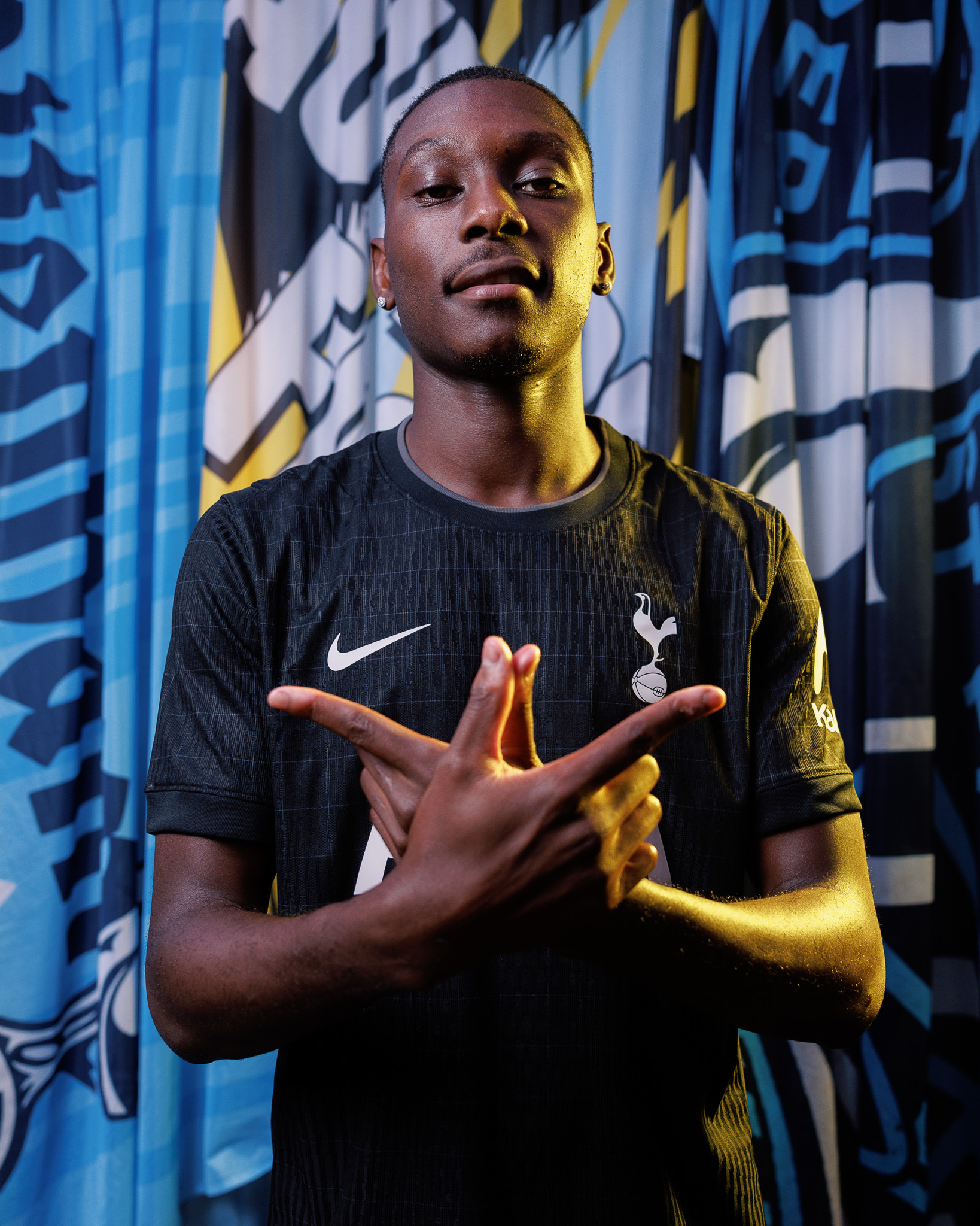 Randal Kolo Muani crosses his hands in a W symbol.